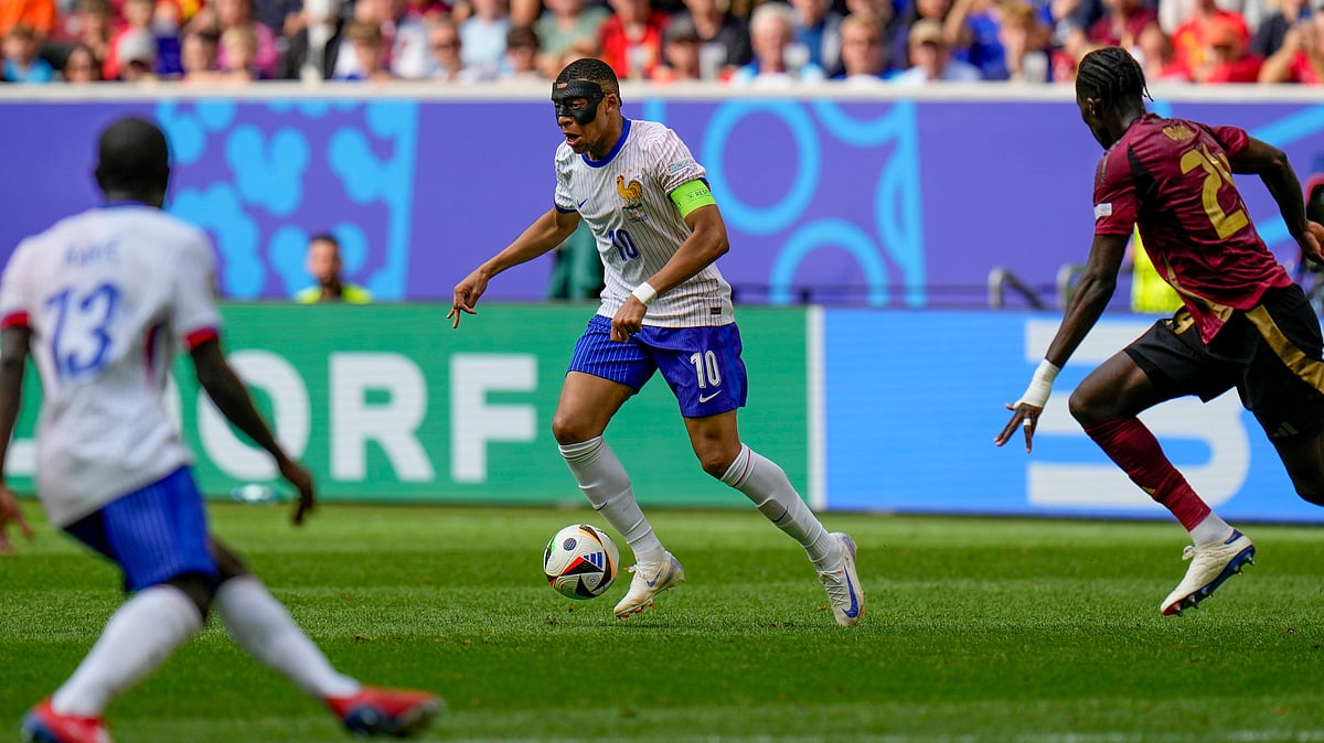 France's Kylian Mbappe runs with the ball during a round of sixteen match between France and Belgium at the Euro 2024. -  (AP Photo/Hassan Ammar)



